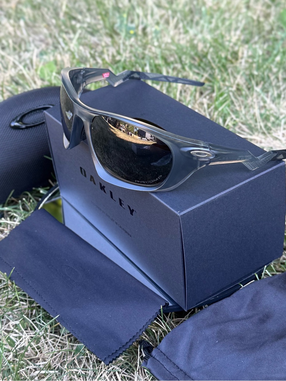 Oakley Sunglasses Translucent Gray Frame with Dark Lenses